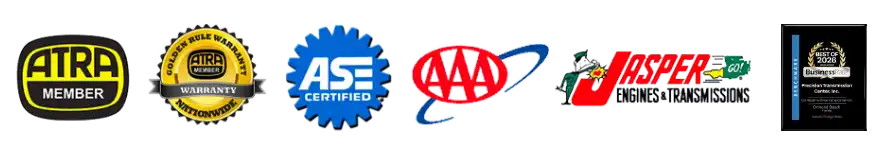 Row of Badges indicating different certifications and transmission specialties, including a badge for ATRA members & warranty, ASE certification, AAA, Jasper Engines & Transmissions, and a Best of 2026 from Business Rate.